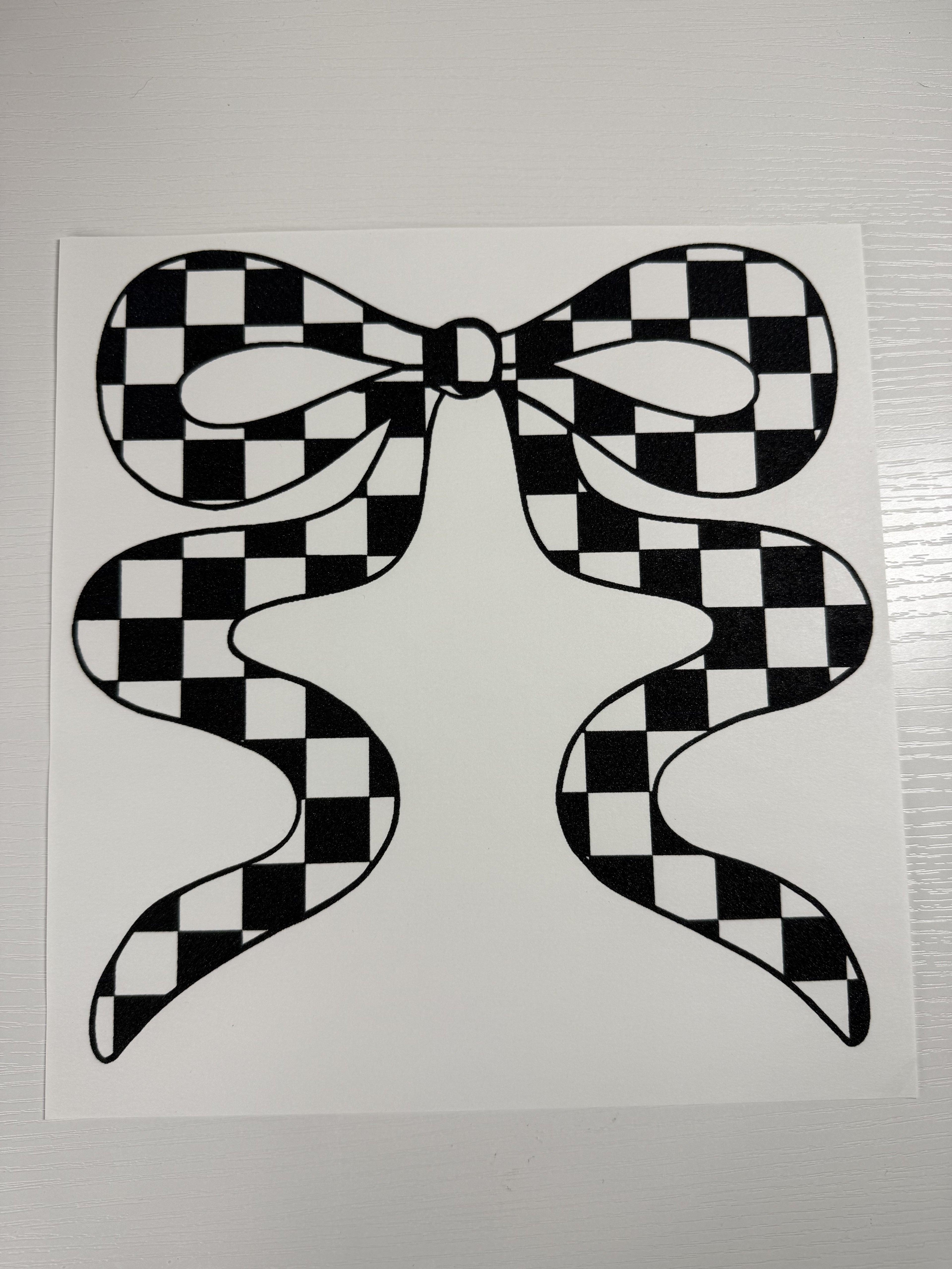 Black checkered bow screen print ￼